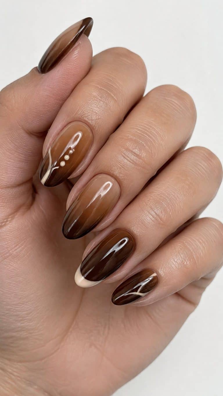 A glossy brown ombre manicure