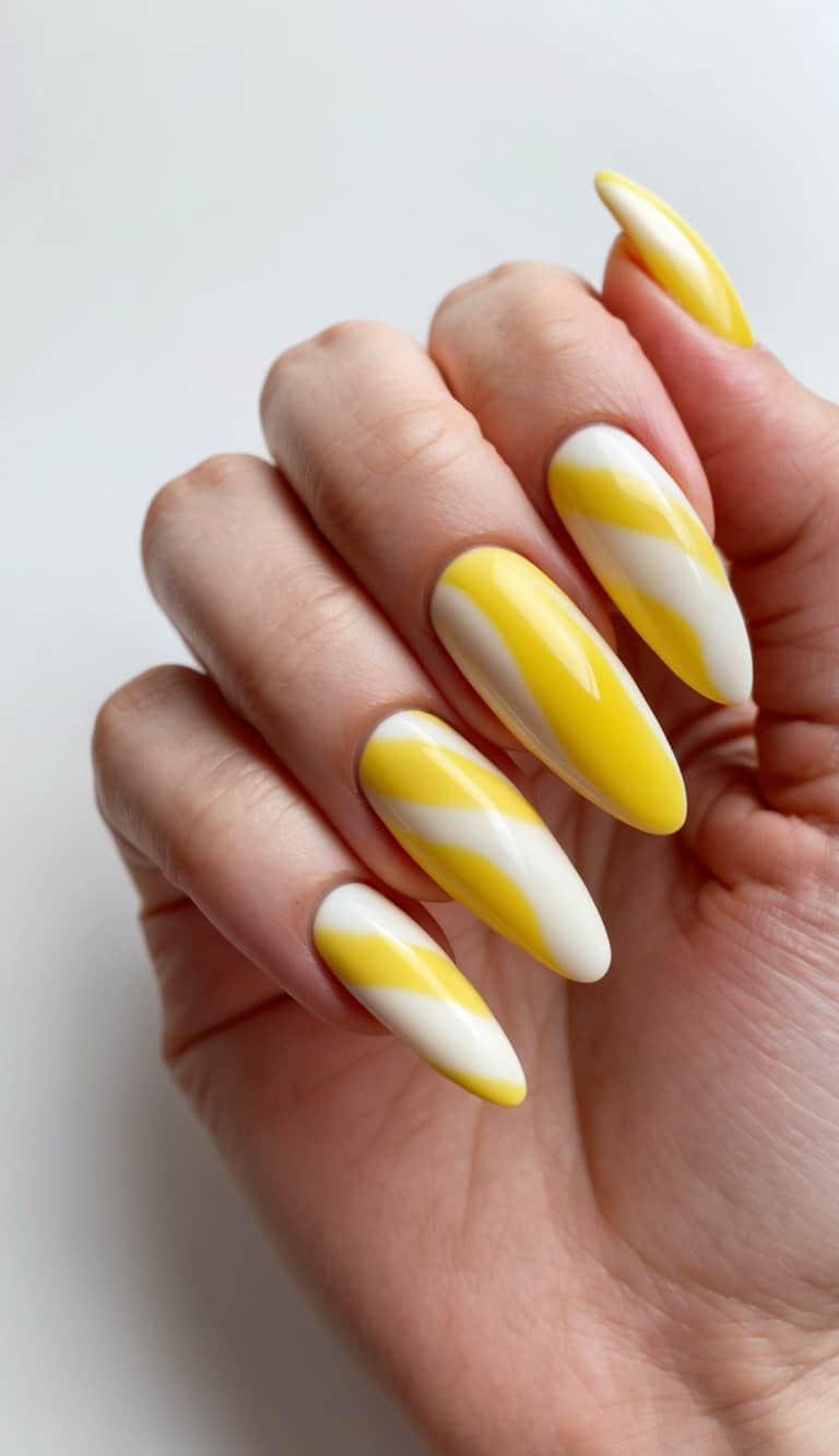 Yellow and white swirls of custard candy on nails