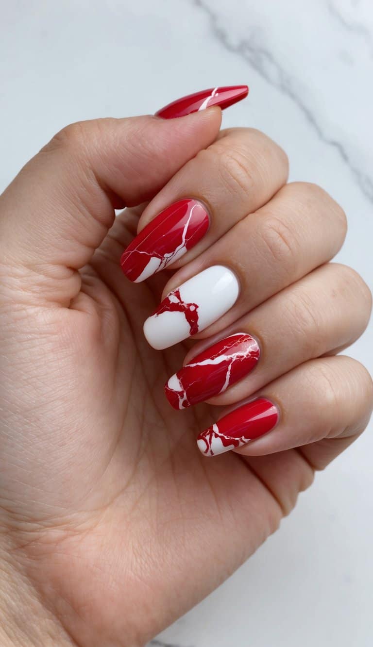 Vibrant red and white marble nail art designs on display