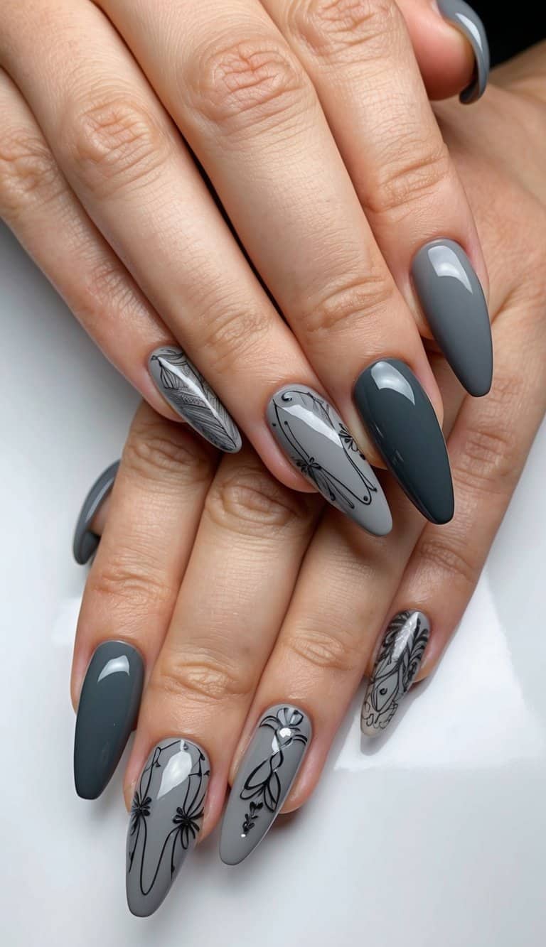 A close-up of charcoal gray nails with various intricate designs