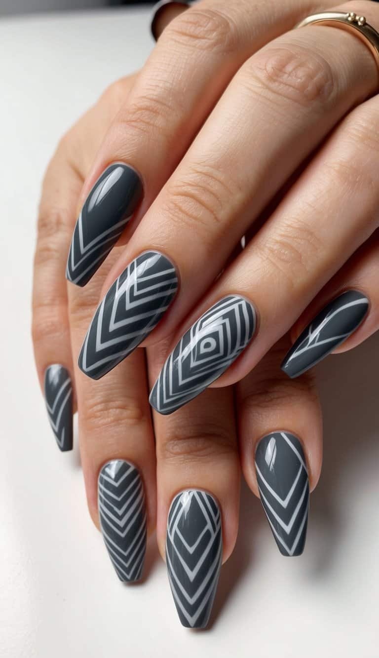 A close-up of charcoal gray tribal patterns on nails, featuring intricate and striking nail art designs