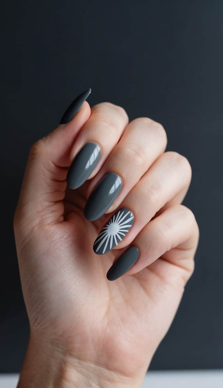 A charcoal gray nail with a sunburst design against a dark background