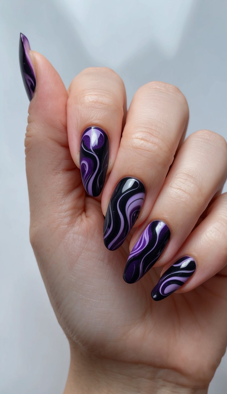 A close-up of a hand against a soft gray background displays long almond-shaped nails with glossy black polish layered with flowing lavender and violet swirl patterns in a purple and black nail art idea.