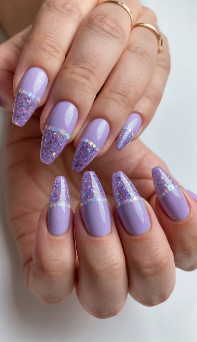 Glossy lilac nails with sparkling purple glitter tips and holographic accents, giving a cute and glamorous nail art effect.
