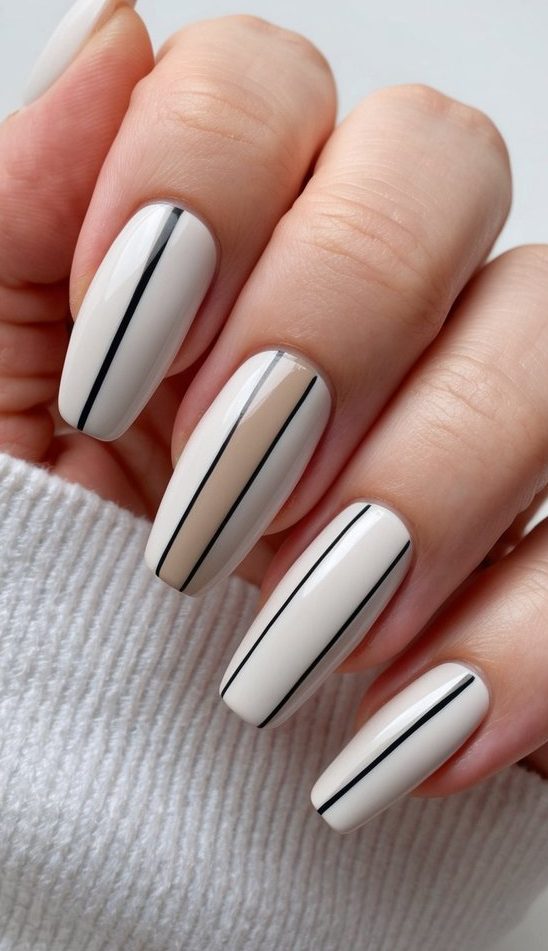 Sleek black line design on a neutral base—this minimalist prom nail art idea is perfect for a timeless yet modern prom look.