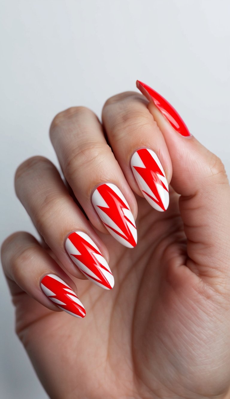 Hand with almond-shaped nails featuring sharp red lightning bolts on a white base, showing a bold and cute red nail art idea.