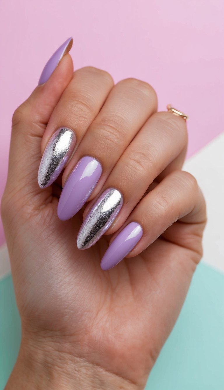 A close-up of a hand wearing a lilac nail art idea featuring glossy lilac nails paired with reflective silver chrome accent nails against a pastel background.