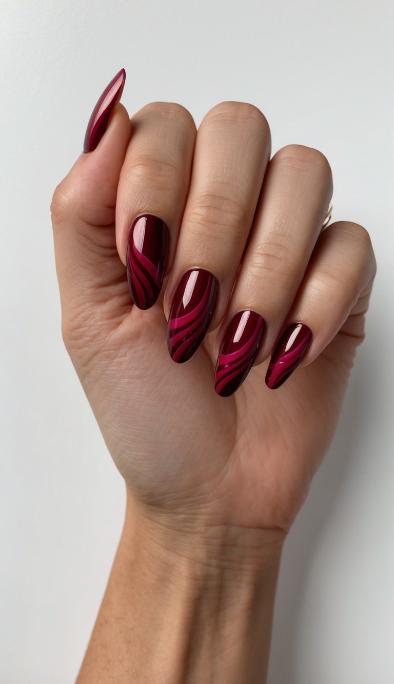 Fingers slightly curled against a plain wall featuring a red chrome nail art idea with long almond nails in glossy crimson chrome and darker red flowing stripe designs.