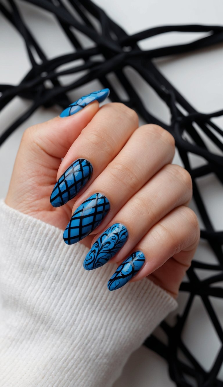 Manicured hand positioned near a decorative black geometric object showing a black and blue nail art idea with cobalt blue nails detailed with black lattice and filigree patterns.