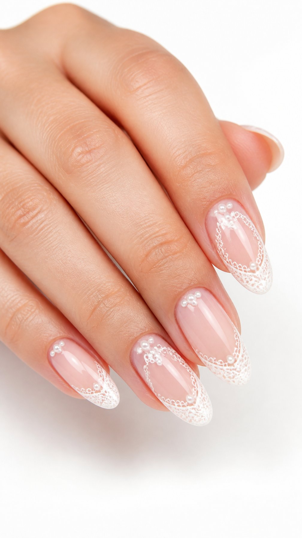 A single hand displays glossy almond-shaped nails with white lace French tips and small pearl accents against a white background.