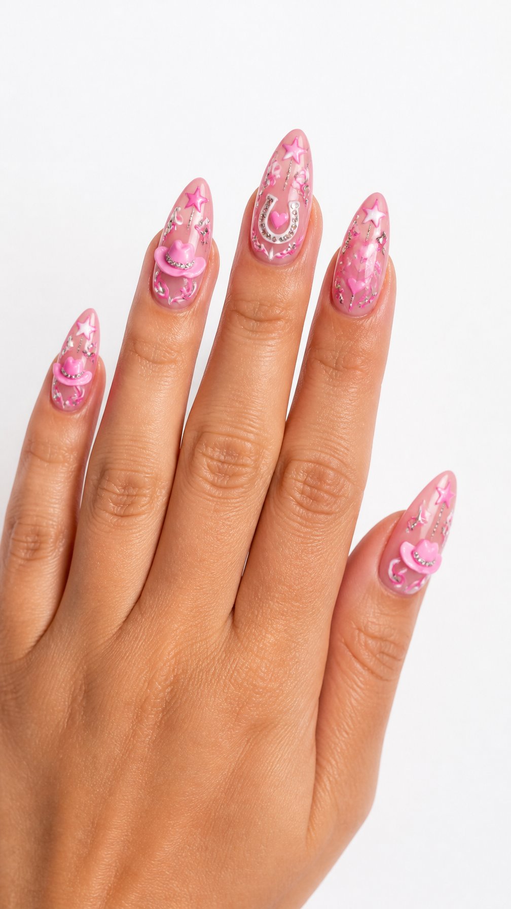 A single hand with glossy pink cowgirl-themed decorated nails against a white background.