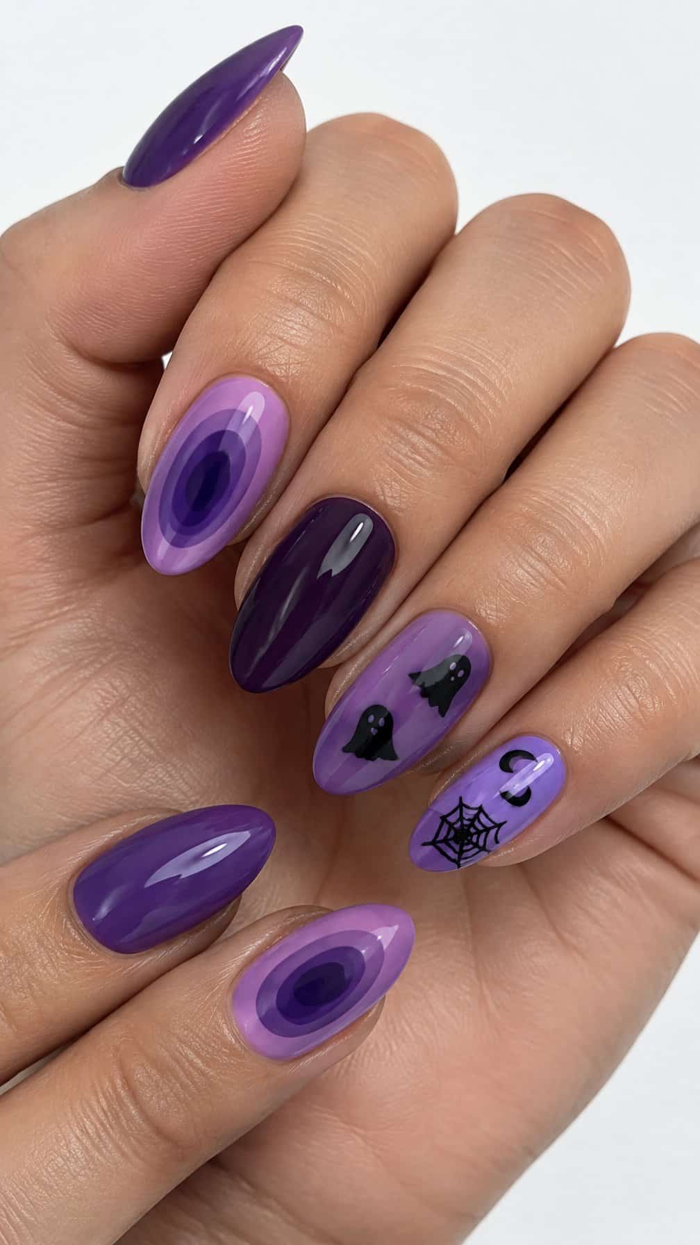 Glossy purple Halloween-themed gel nails