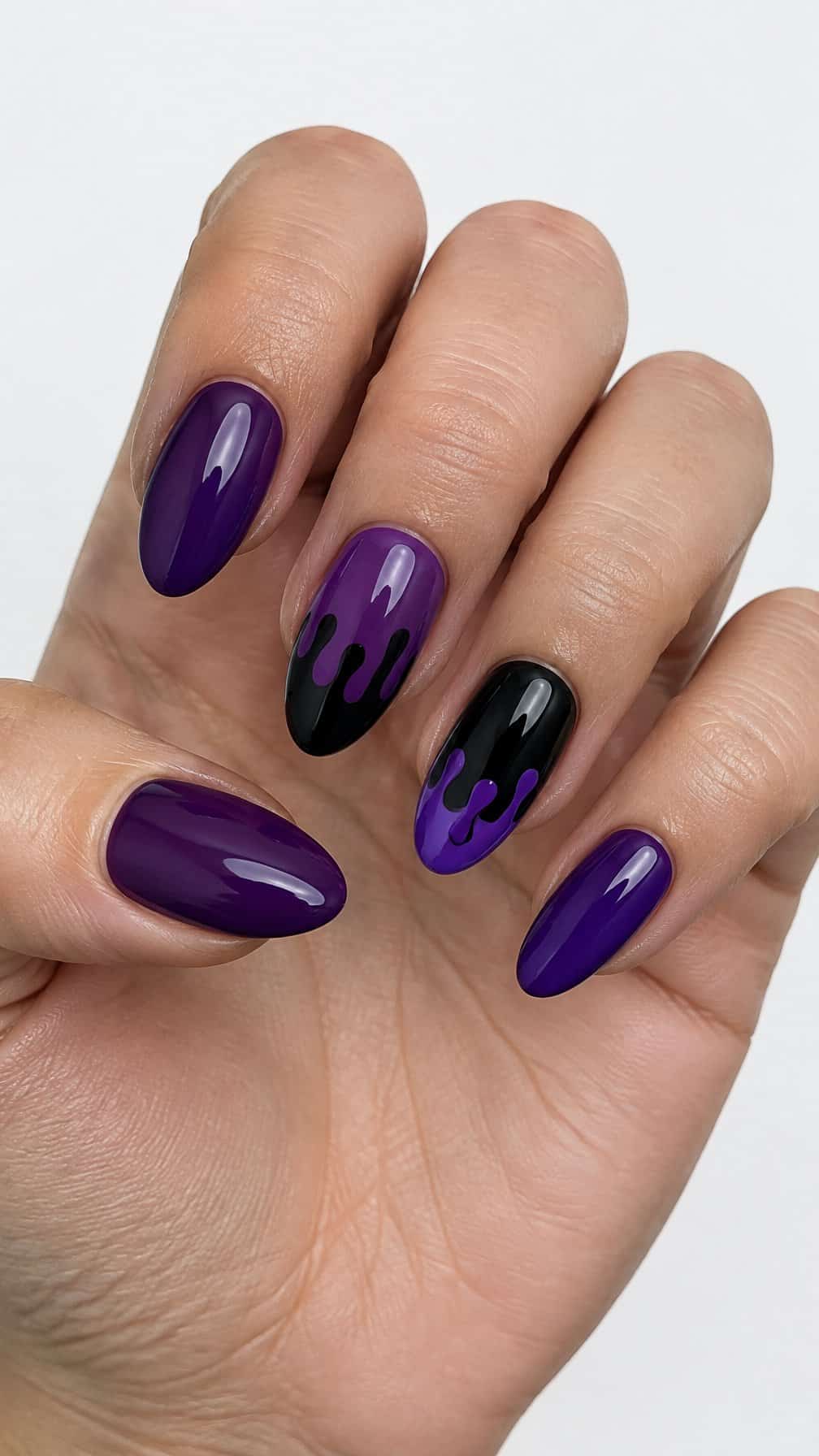 Glossy black and purple dripping nail designs