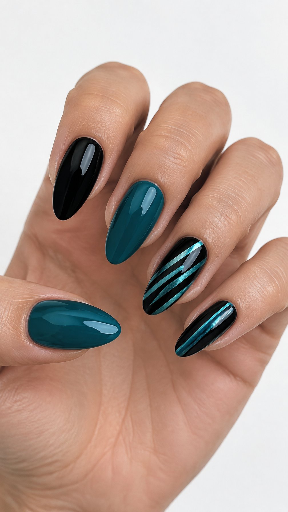 Almond-shaped black and teal glossy manicured nails featuring simple striped accents
