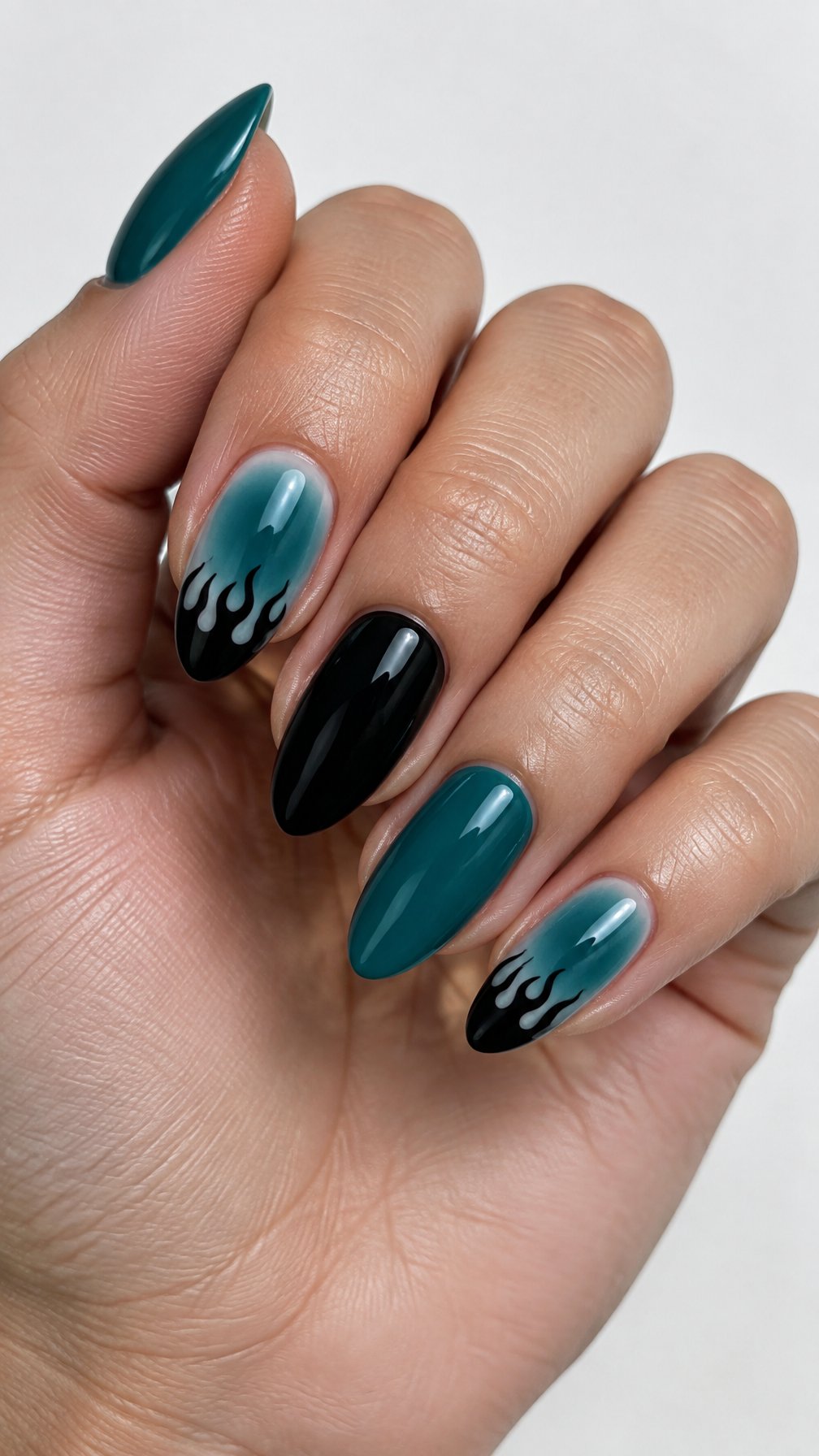 Teal and black flame-tip gel nails rests