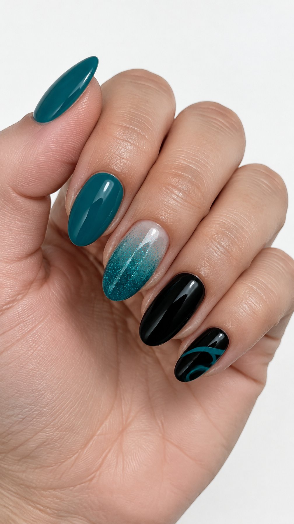 A glossy black and teal manicure with glitter ombré and simple accent designs