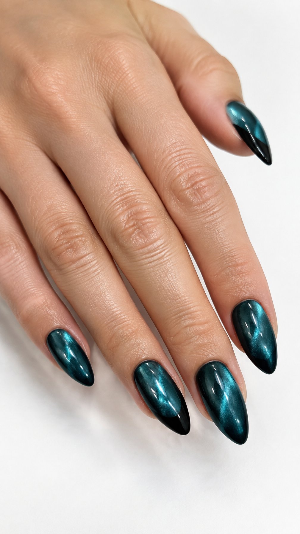 Glossy teal nails featuring black French tips