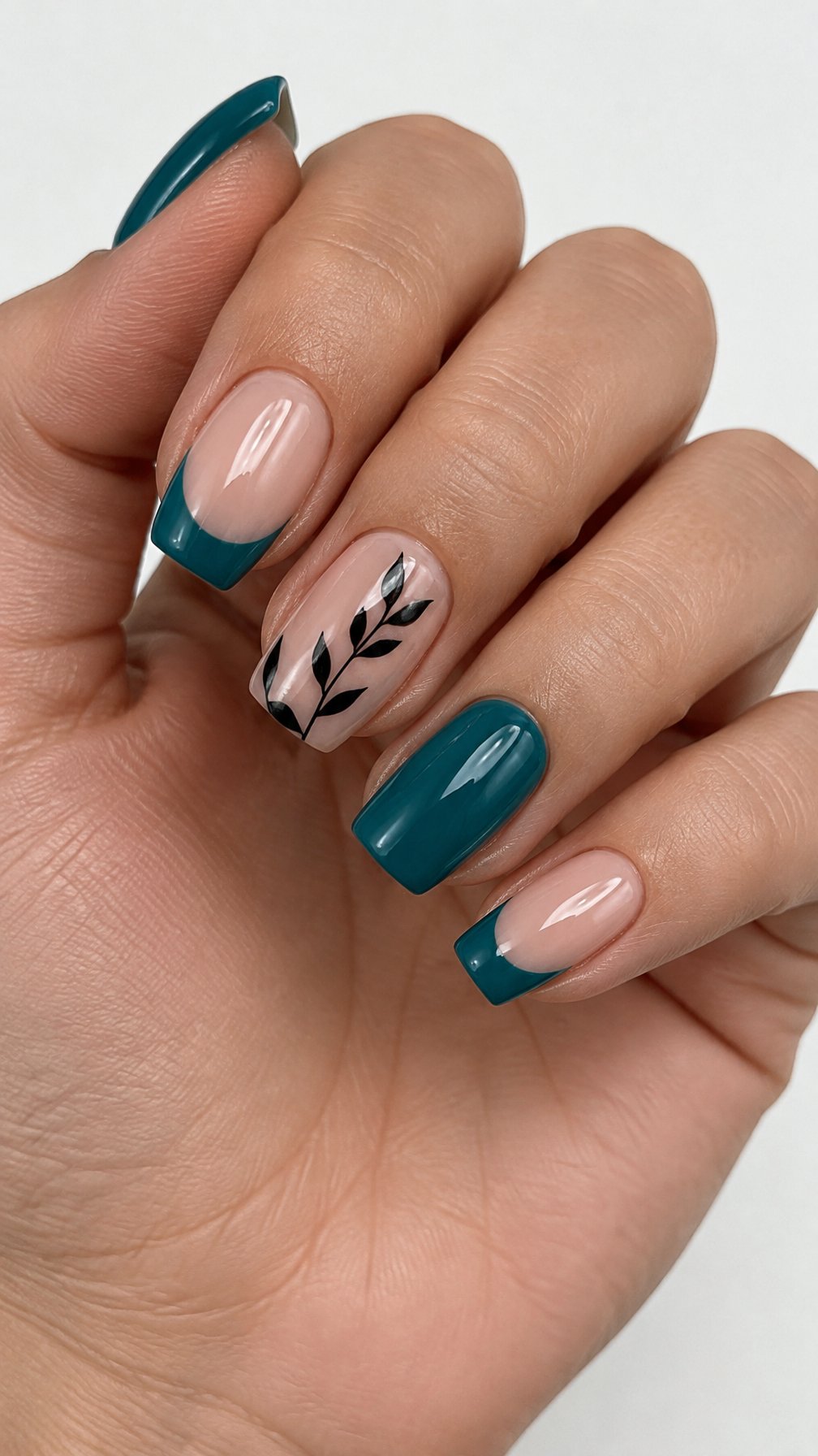 Five glossy teal and black decorated nails
