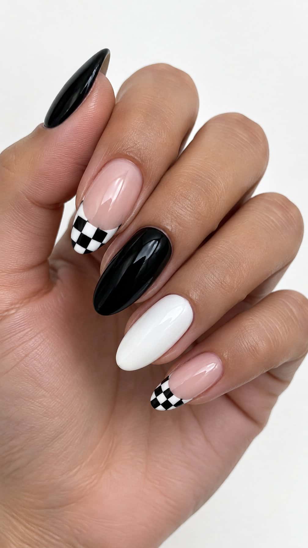 Glossy black-and-white checkerboard French tip nails