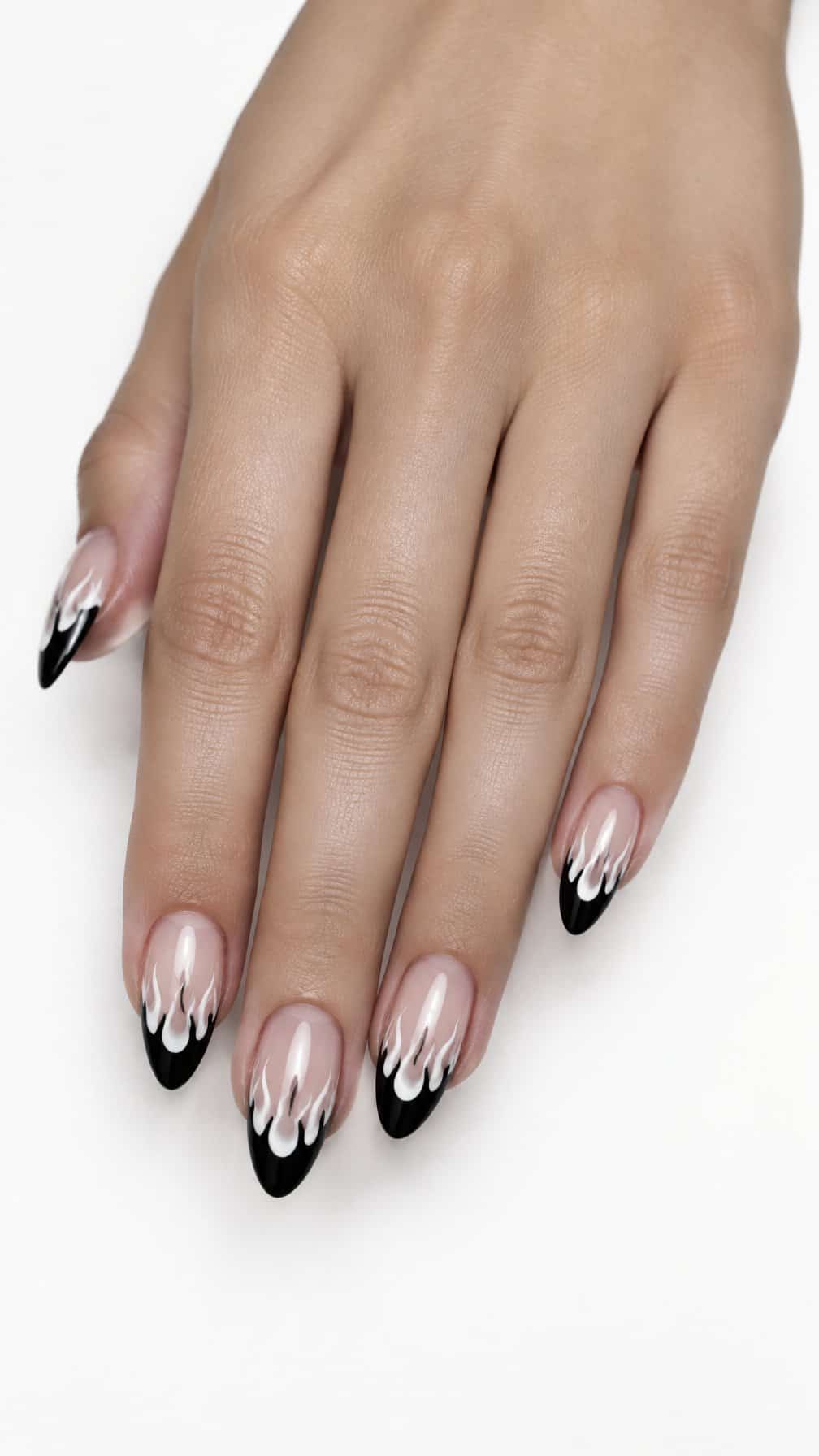 Glossy black French tip nails decorated with delicate white flame designs