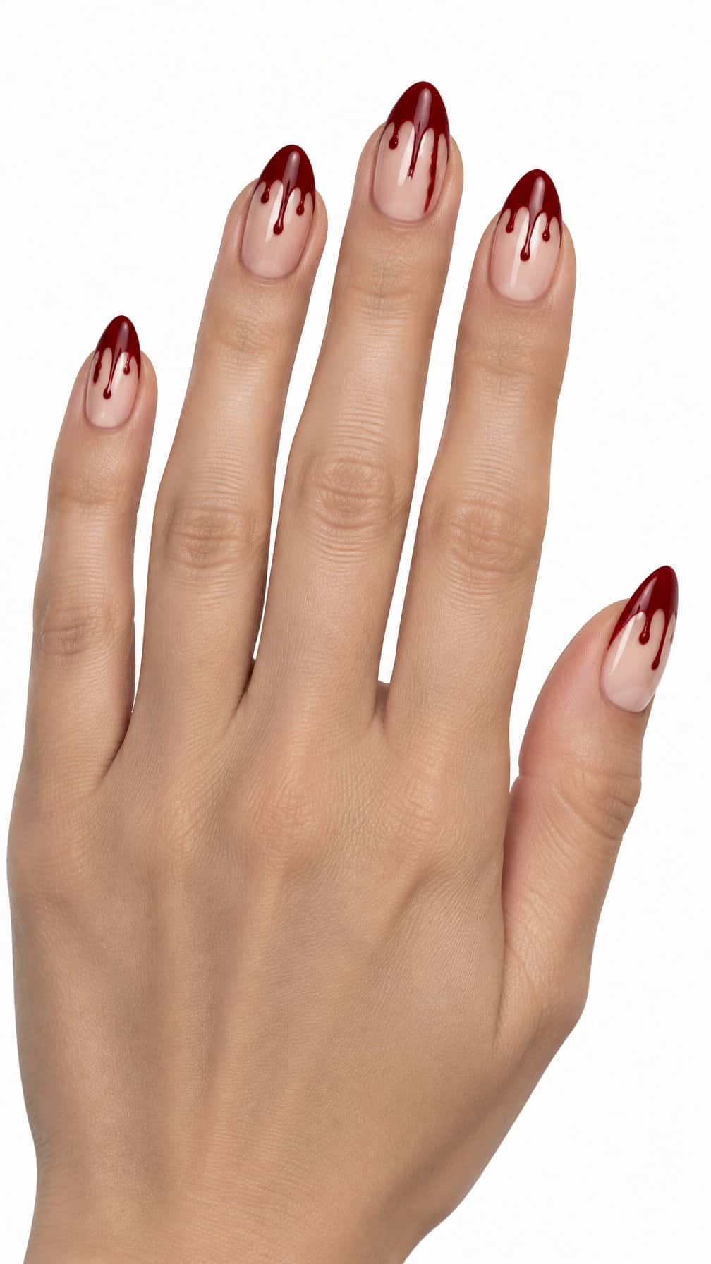 Glossy nude nails decorated with deep red dripping French tips