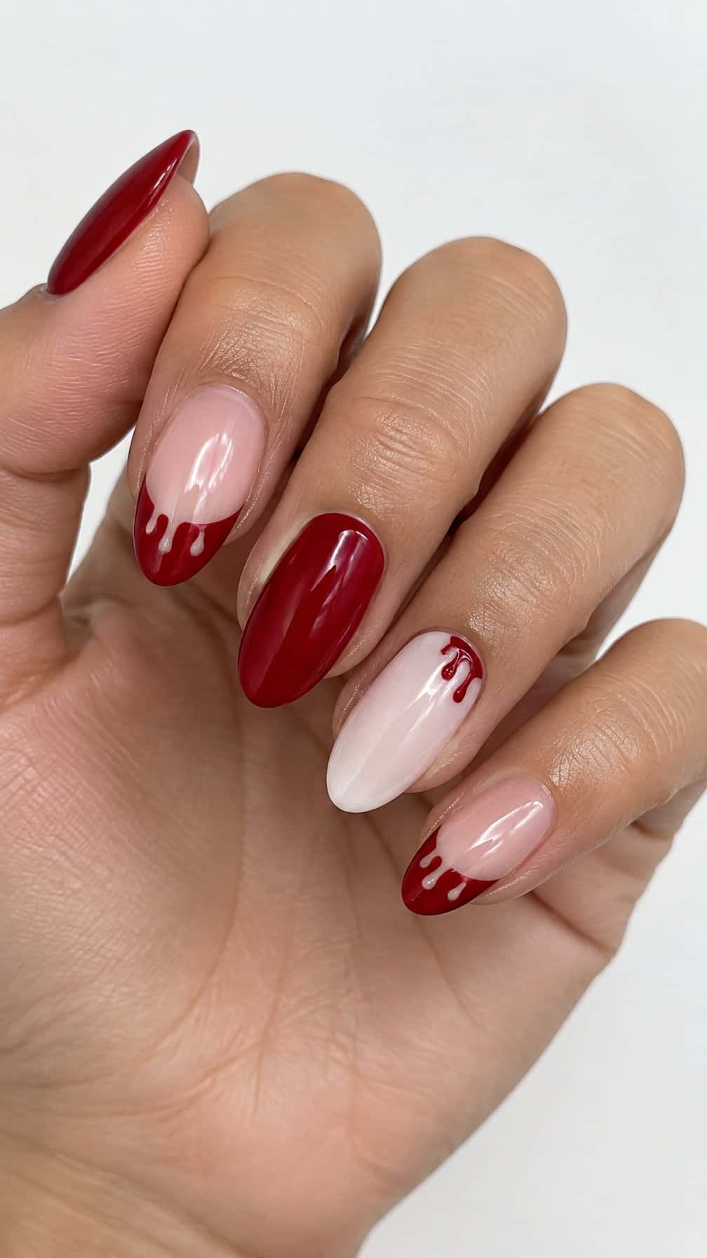 Glossy deep red drip French tip nails
