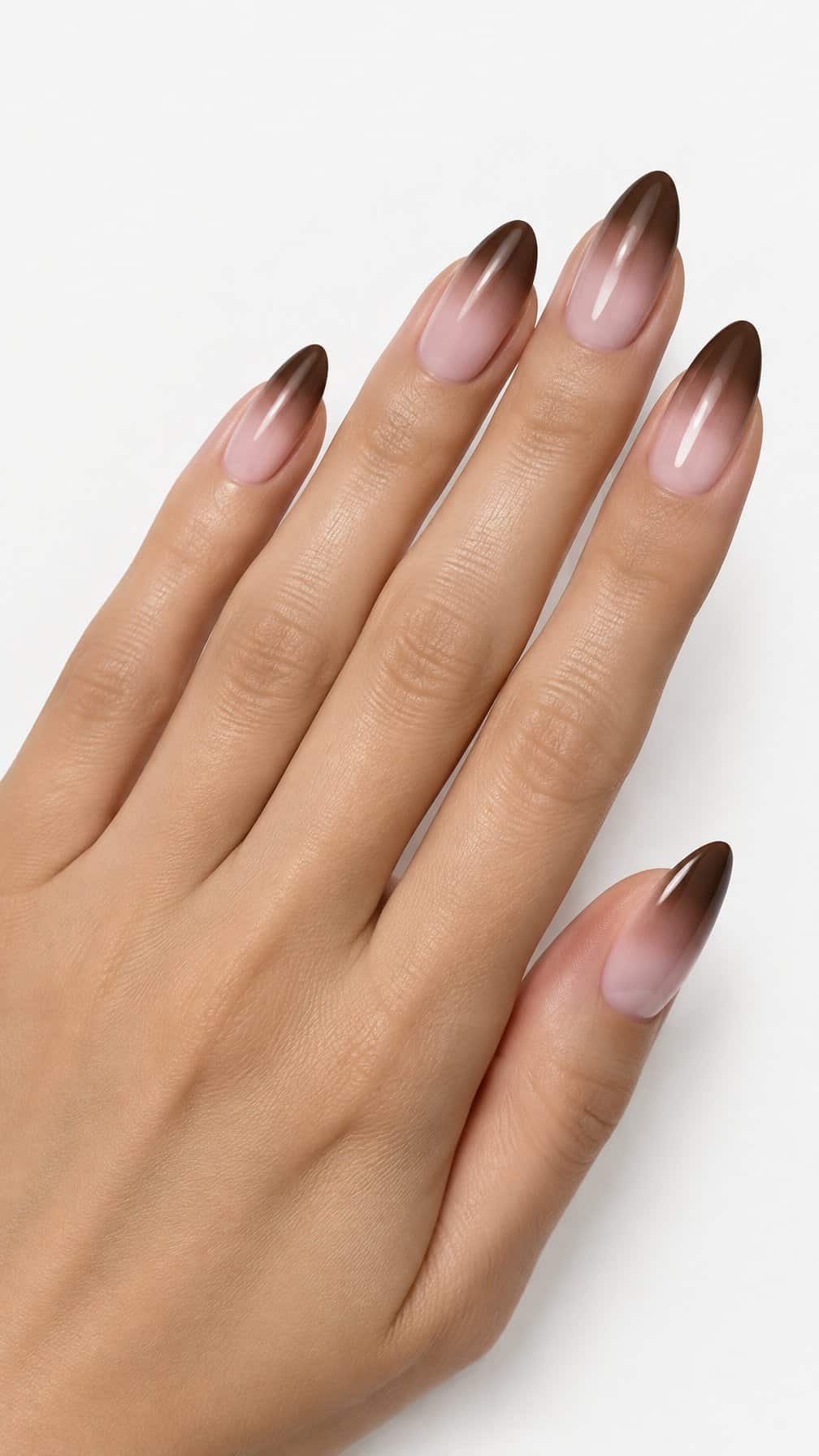 Glossy almond-shaped nails featuring a brown and blush pink ombre design