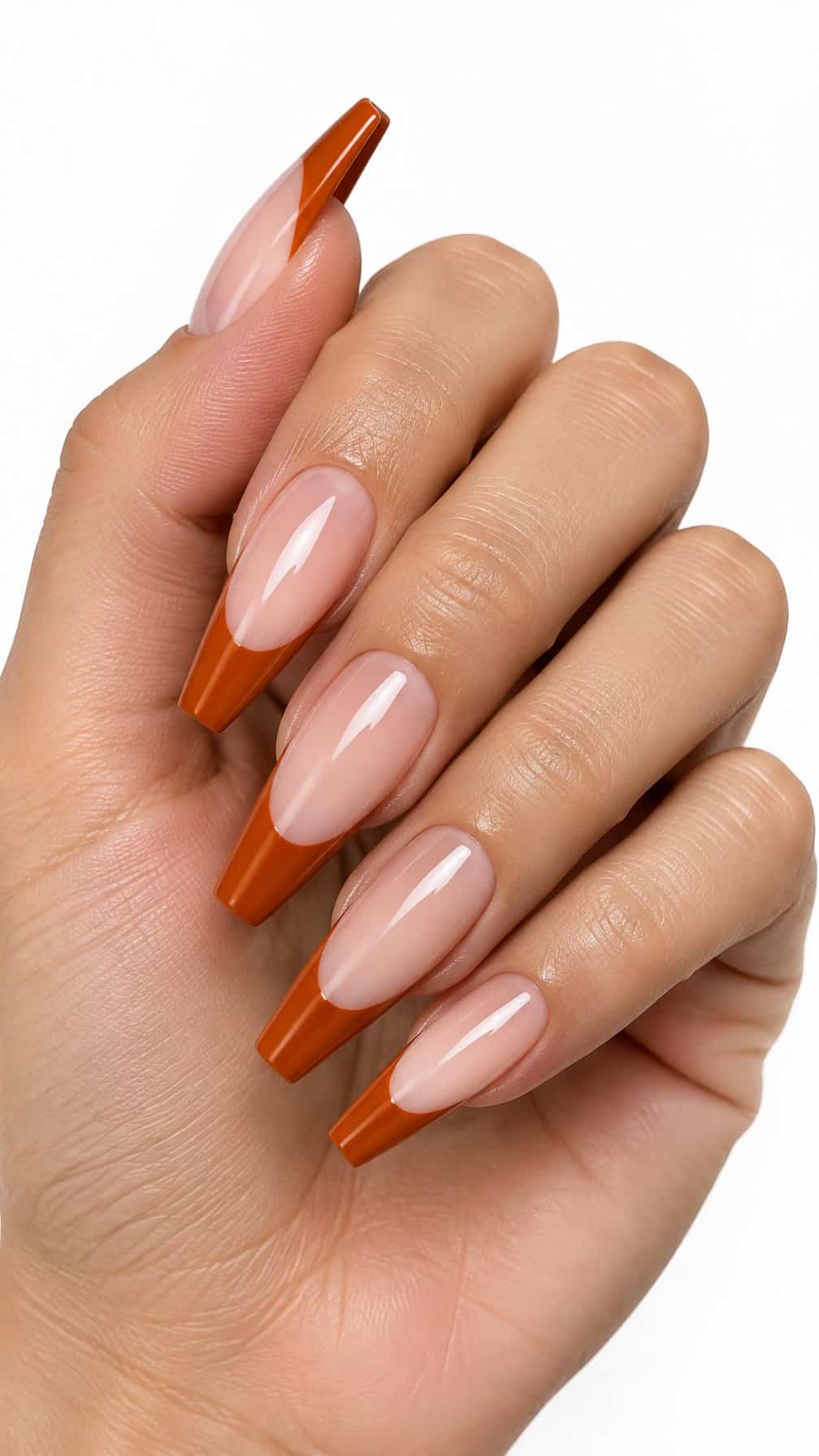 Long burnt orange French-tip coffin nails