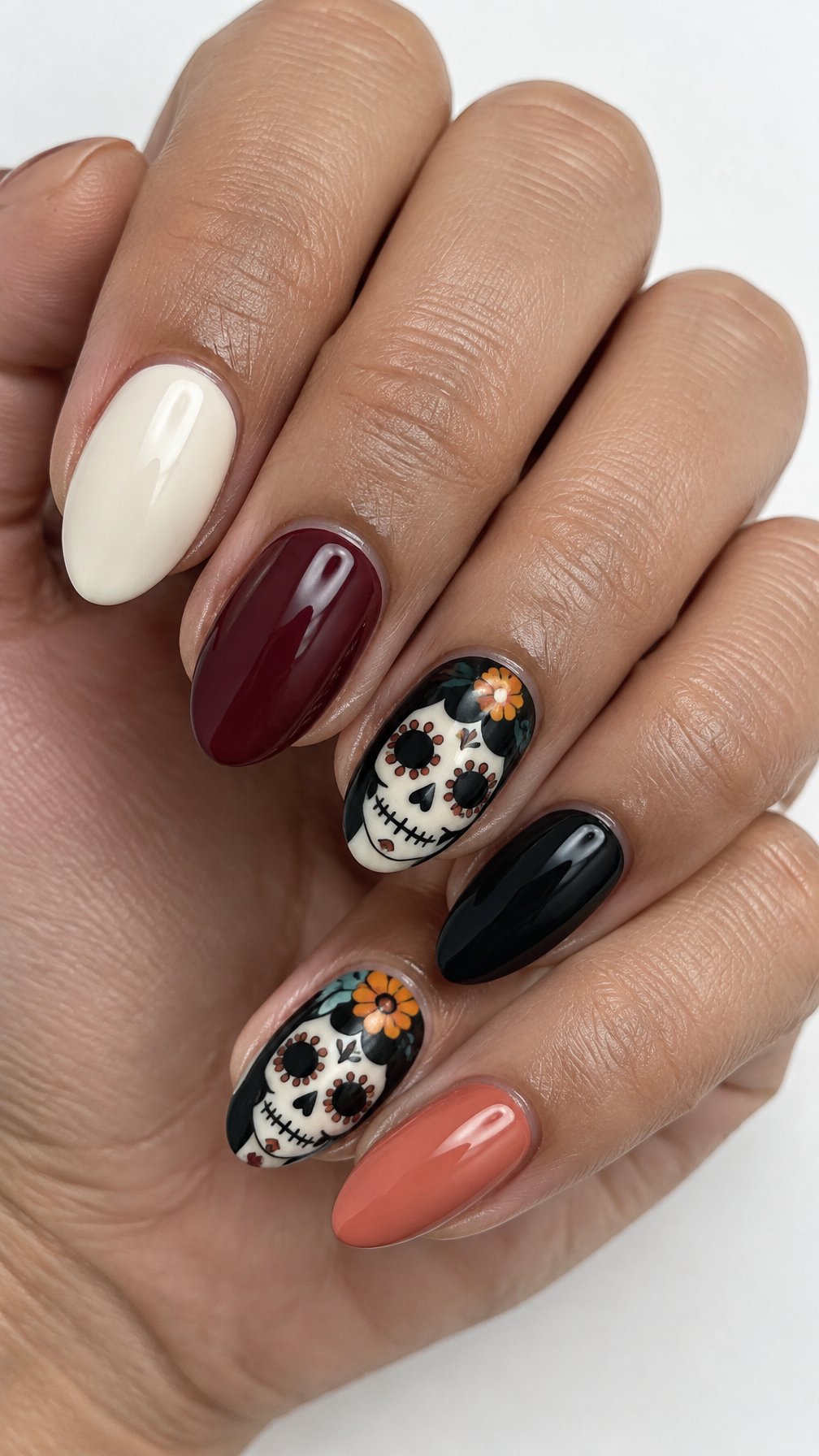 A glossy manicure with colorful solid nails and small decorative portrait designs