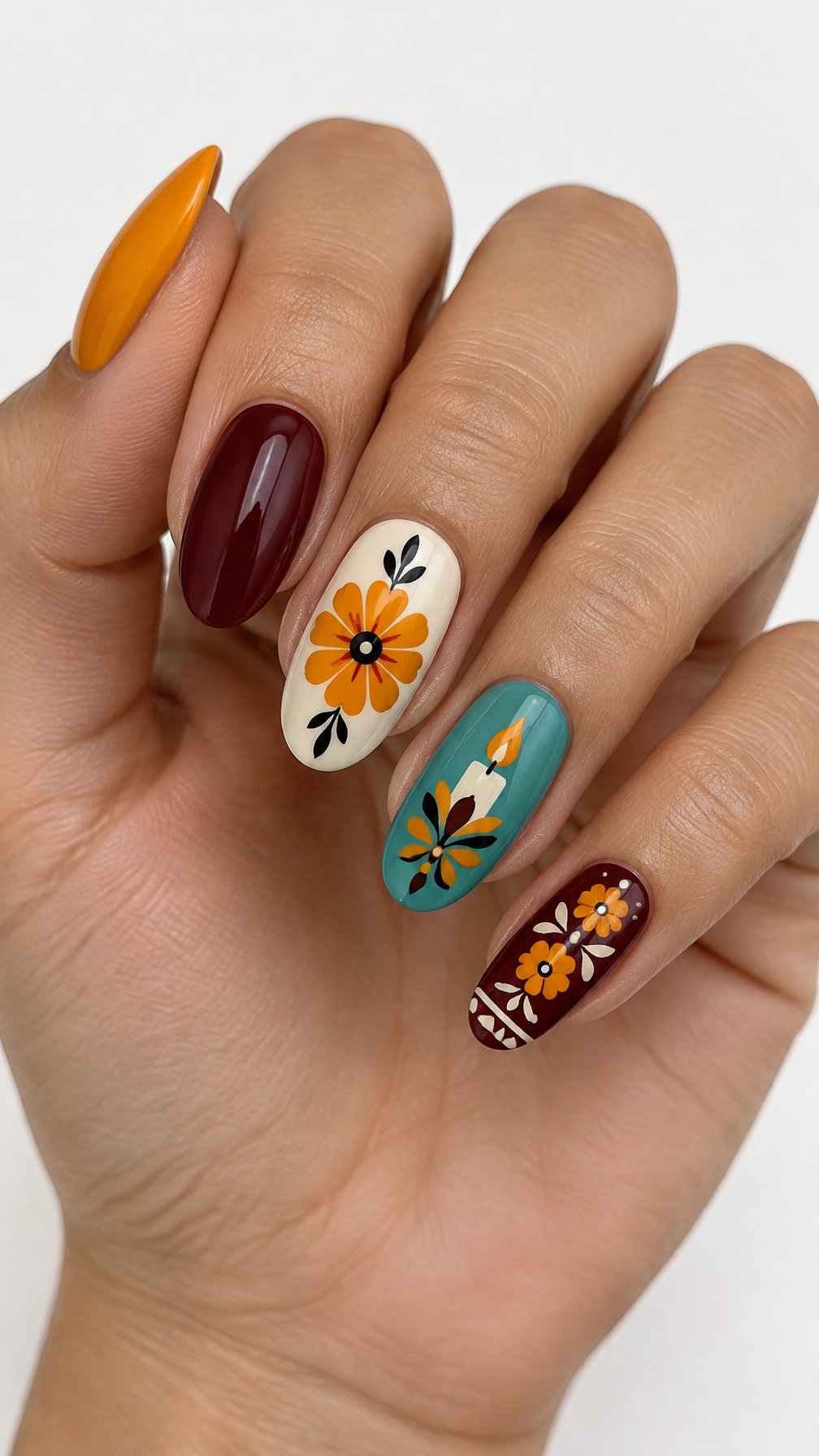 Glossy orange, burgundy, cream, and turquoise decorated nails