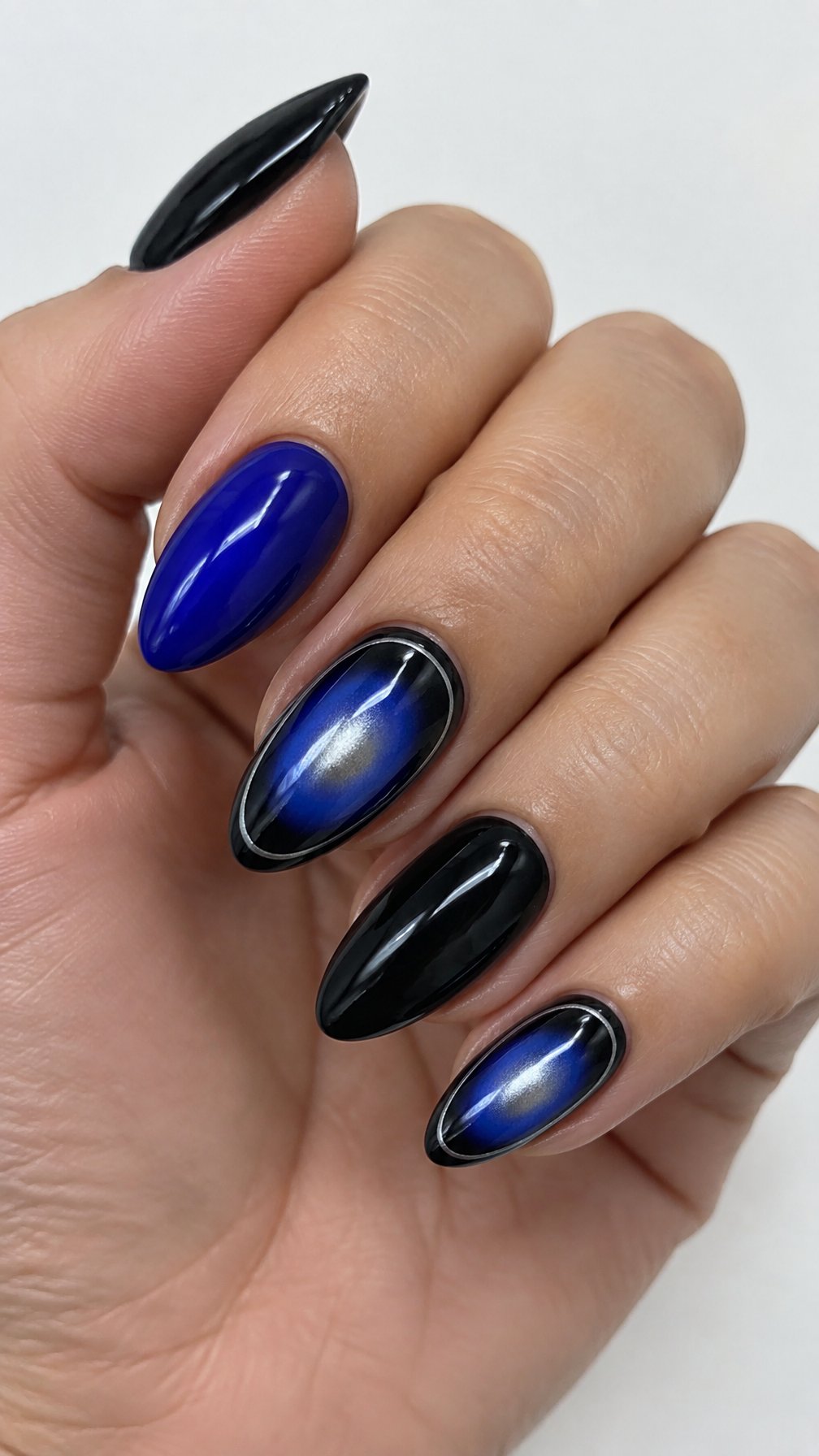 Glossy black and blue manicured nails