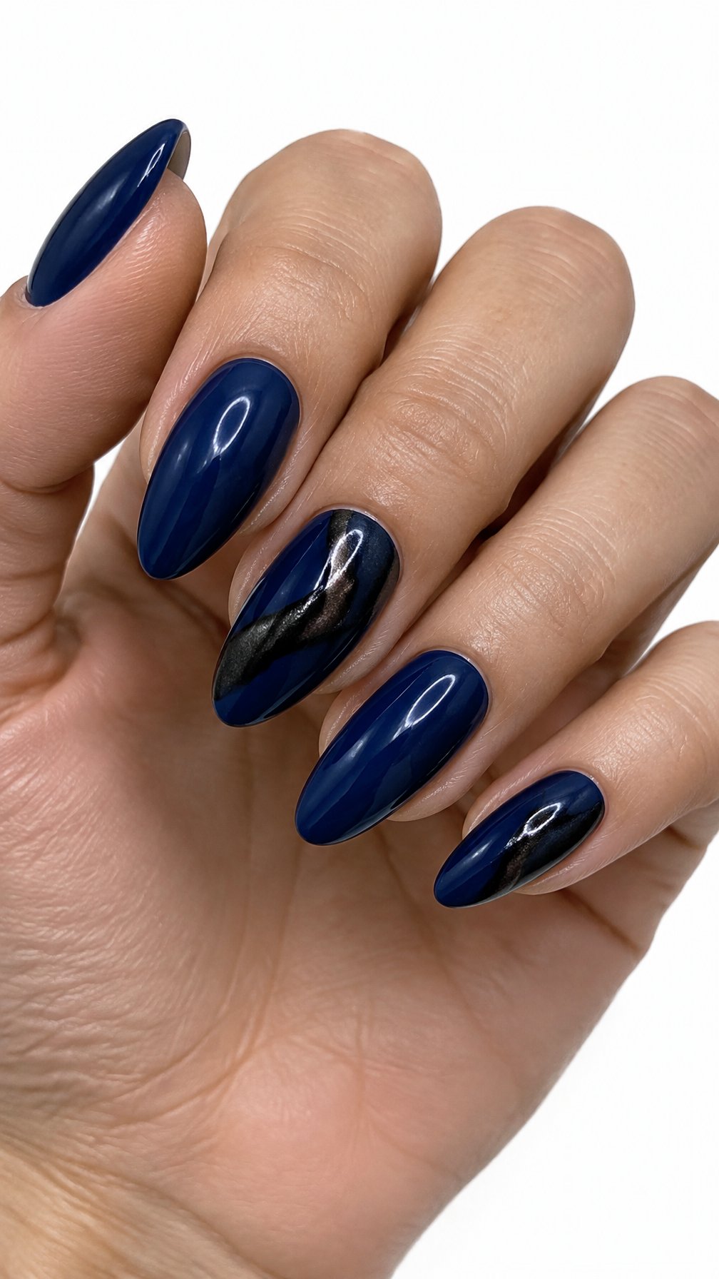 Glossy dark blue gel nails featuring black metallic accents