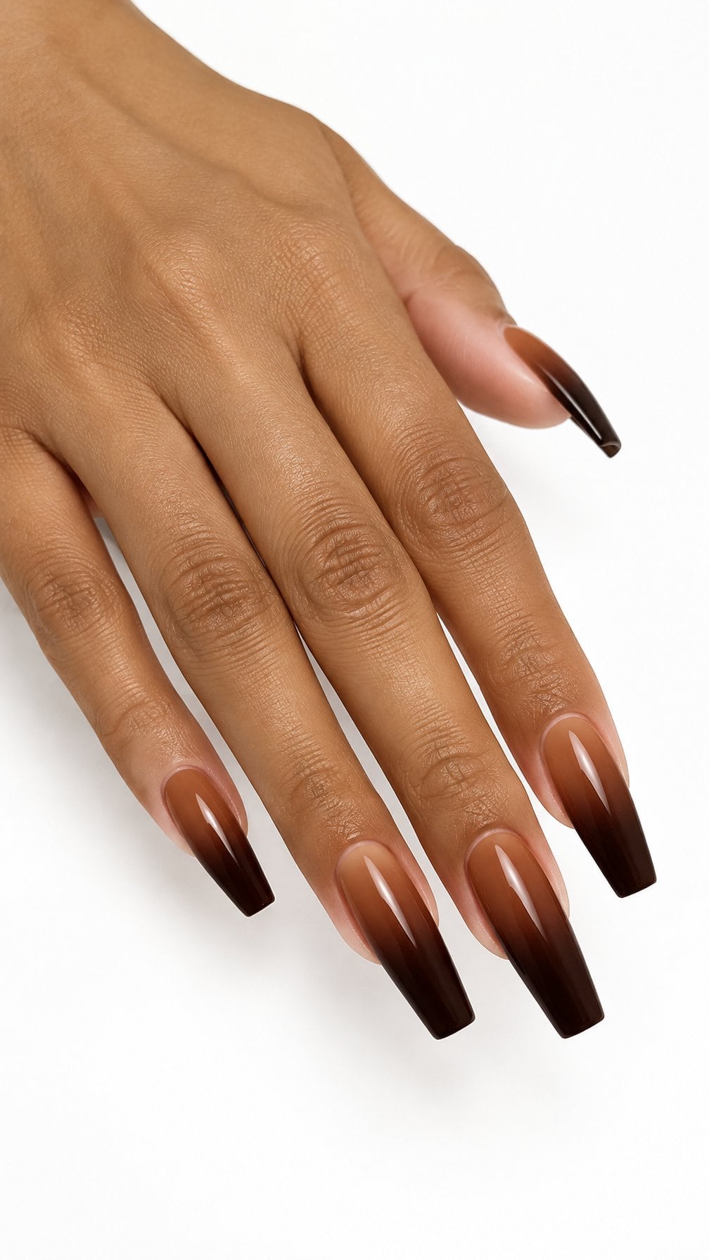 Glossy coffin-shaped nails fading from cinnamon brown to deep cocoa brown