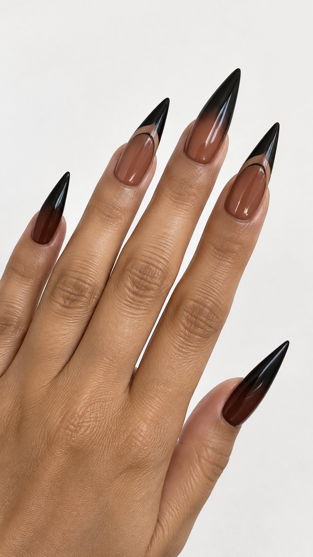 Long glossy brown-to-black pointed nails