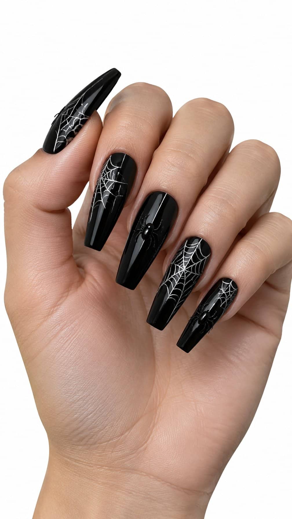 Long coffin-shaped nails decorated with black polish, white spider webs, and small spider designs