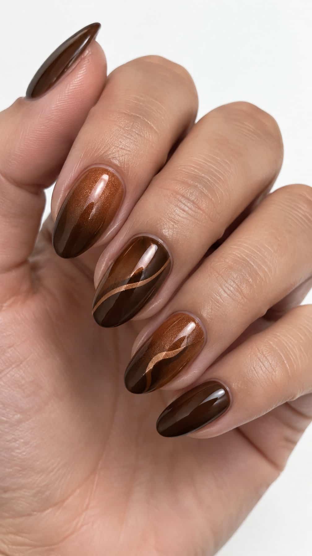 Glossy copper and brown ombre manicure