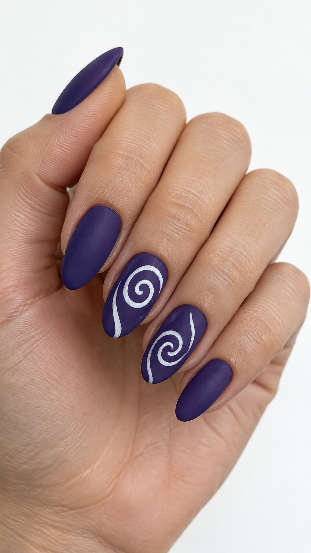 Violet manicured nails featuring white spiral designs on a few nails