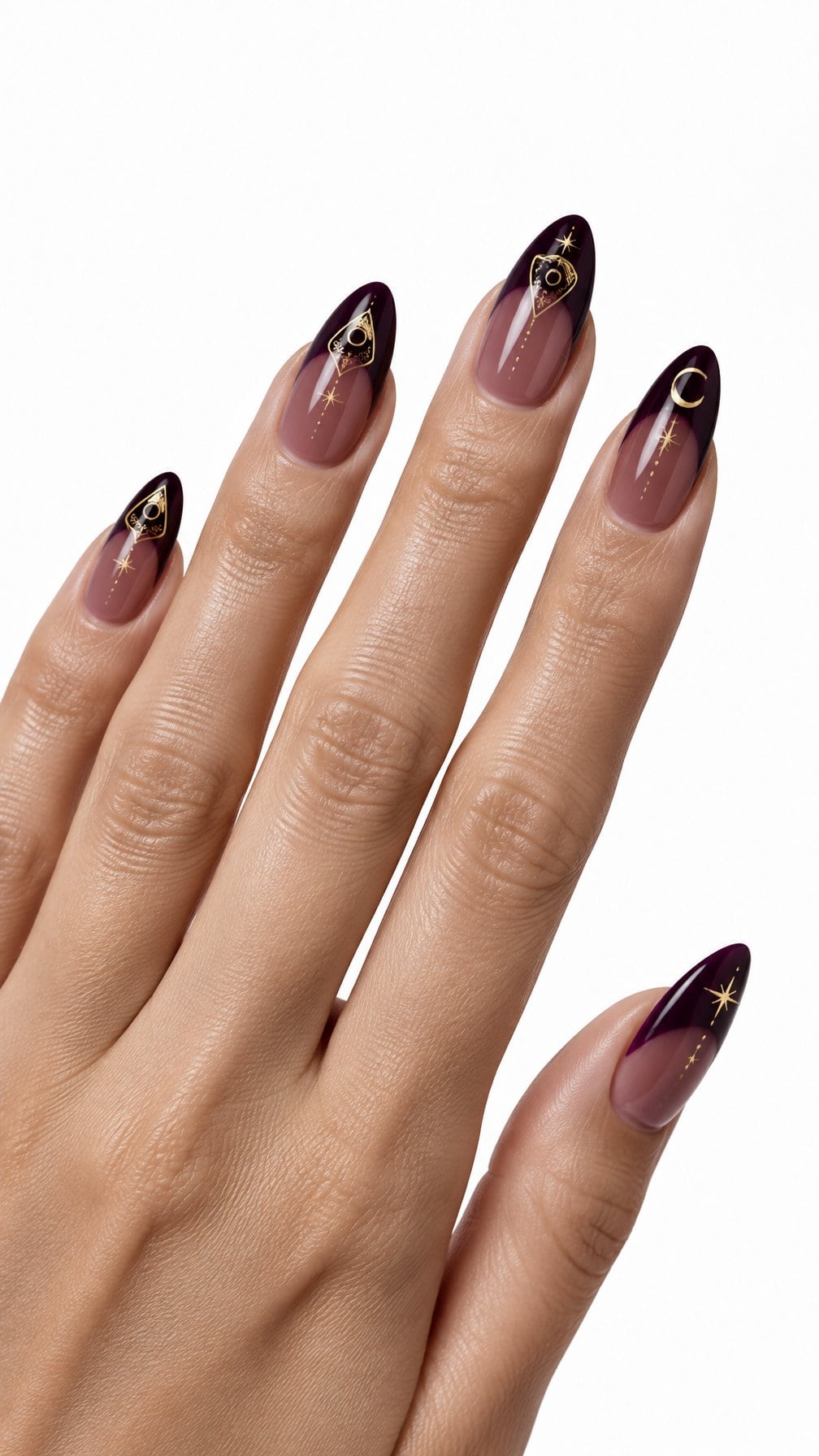 Glossy deep plum French-tip nails decorated with delicate gold planchette designs