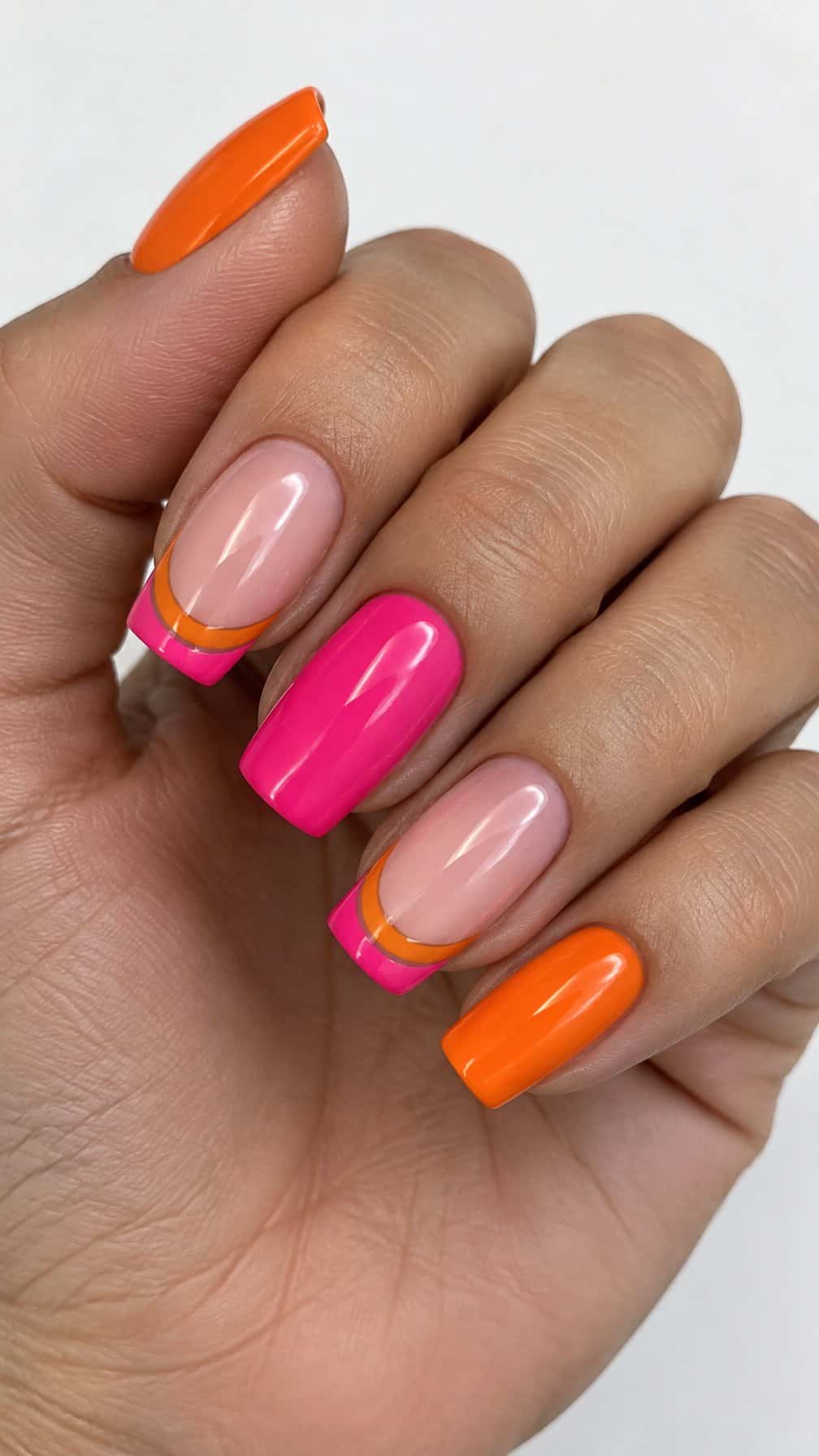 Glossy orange and hot pink French tip nails