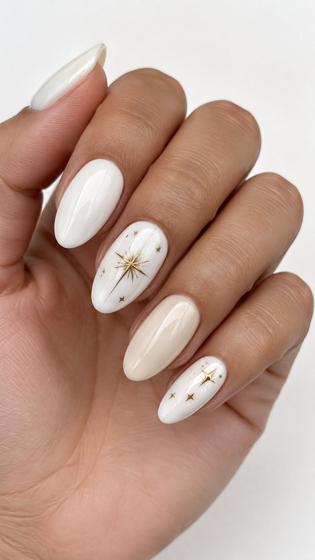 Glossy white and gold starburst nail art