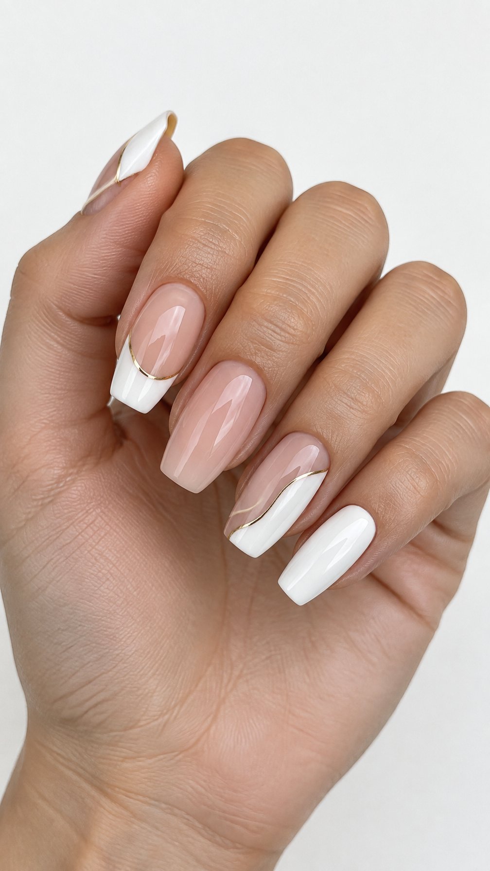 Glossy white and gold French-tip nails
