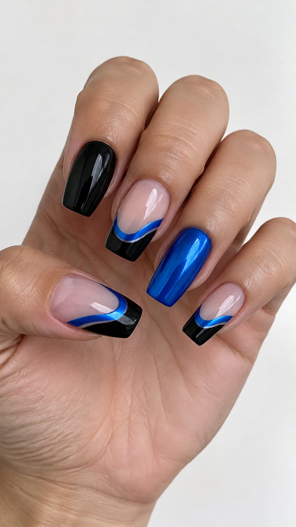Black French tip nails and metallic blue wave accents is shown