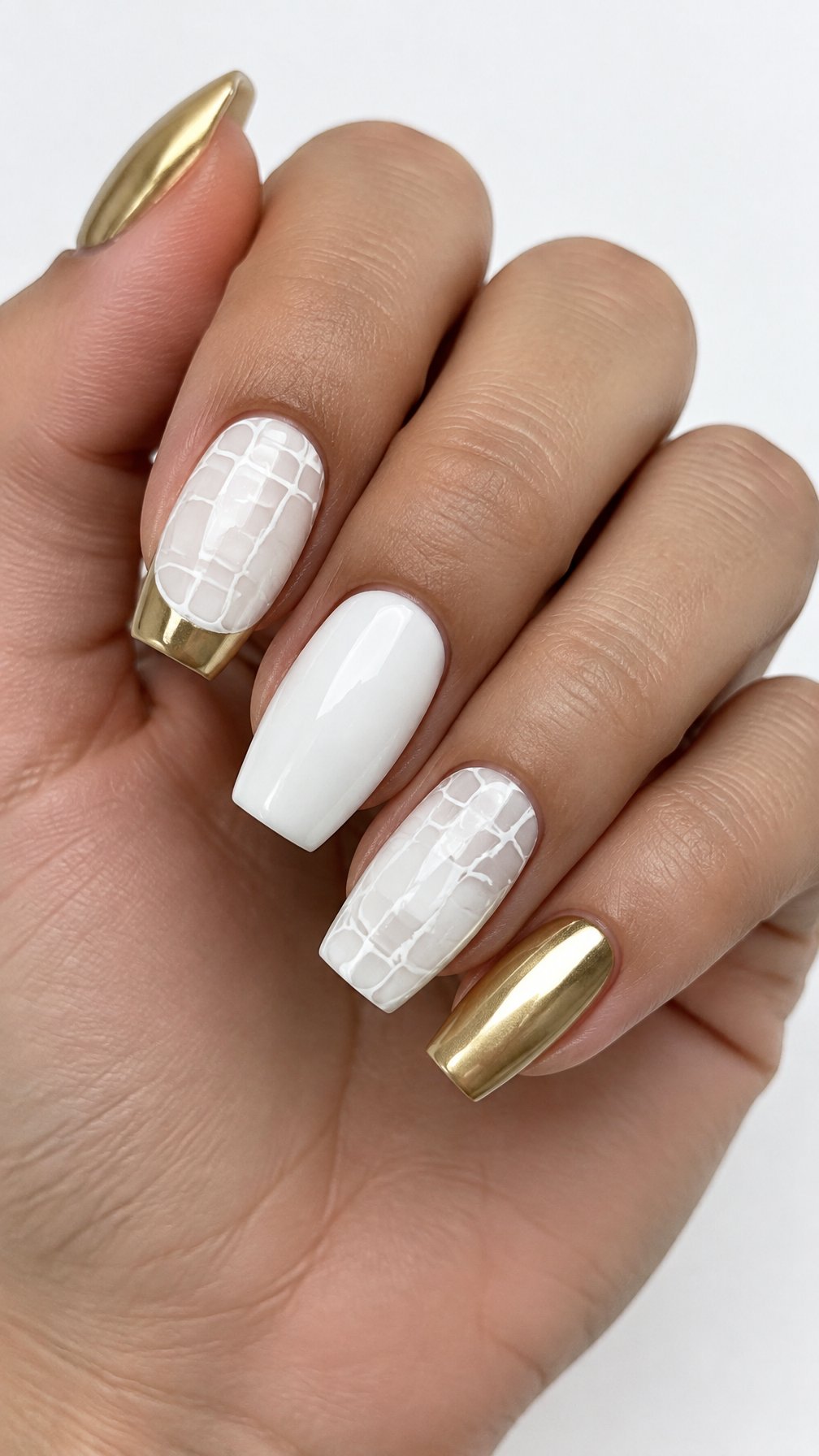 Glossy white crocodile-pattern nails and gold French tips