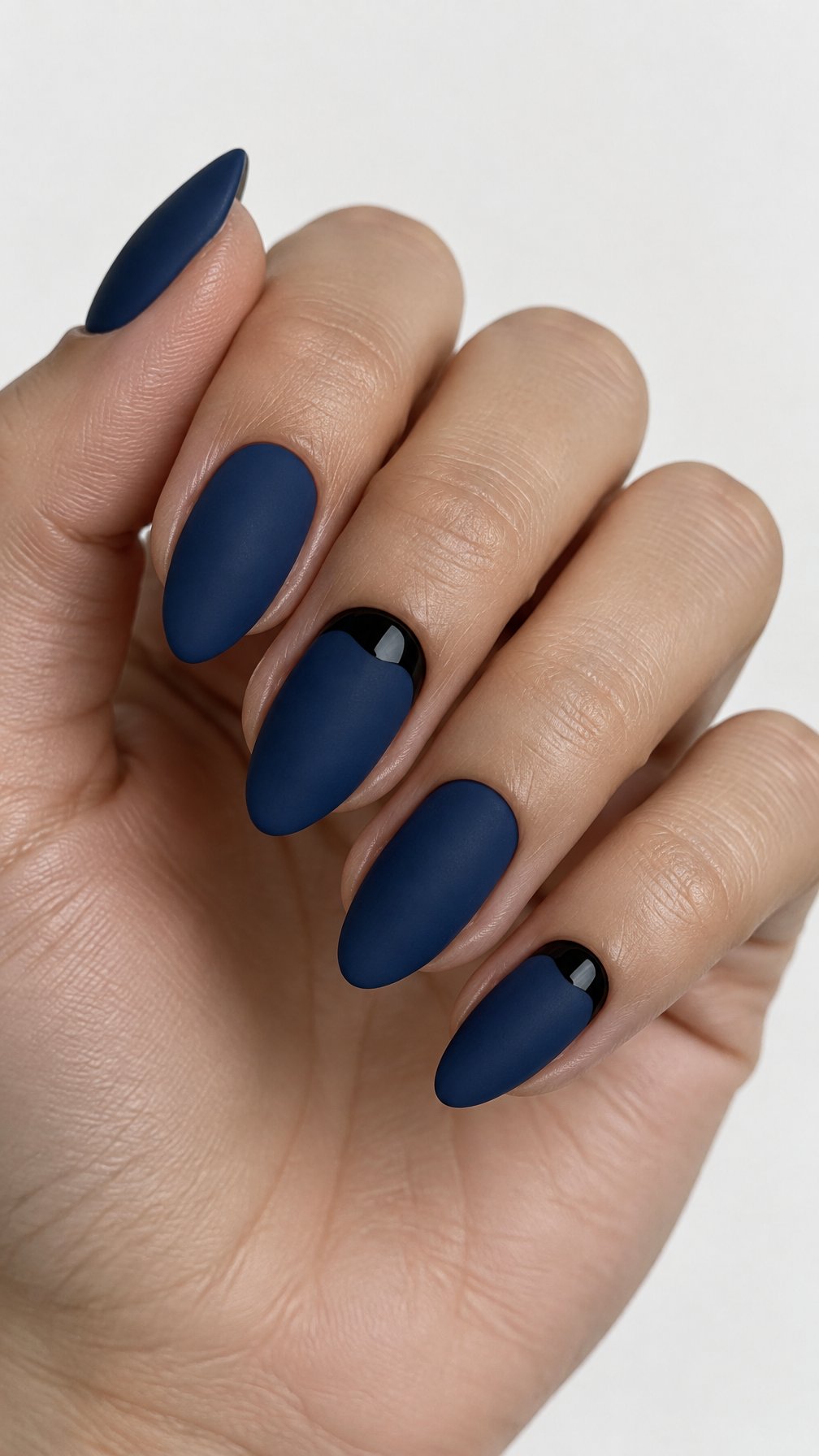 Matte navy nails and glossy black reverse French tips