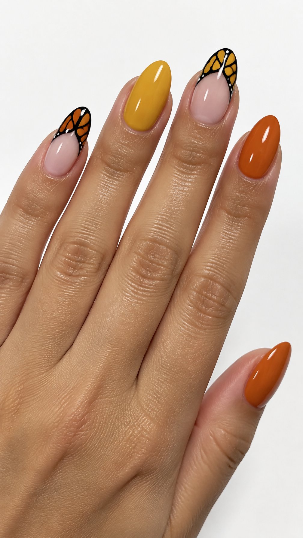 Glossy orange, yellow, black, and white monarch butterfly French-tip nail designs
