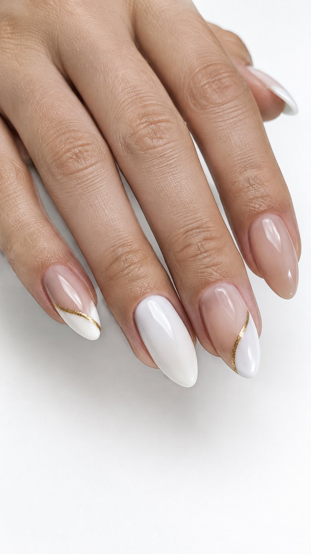 White and gold manicured nails