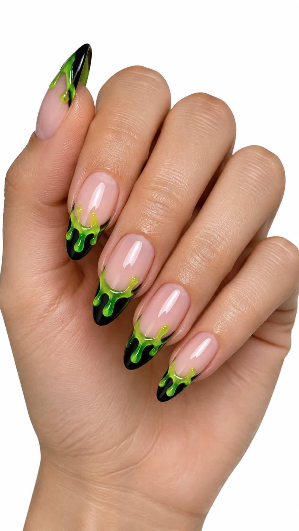 Glossy black French-tip nails decorated with bright green slime drips