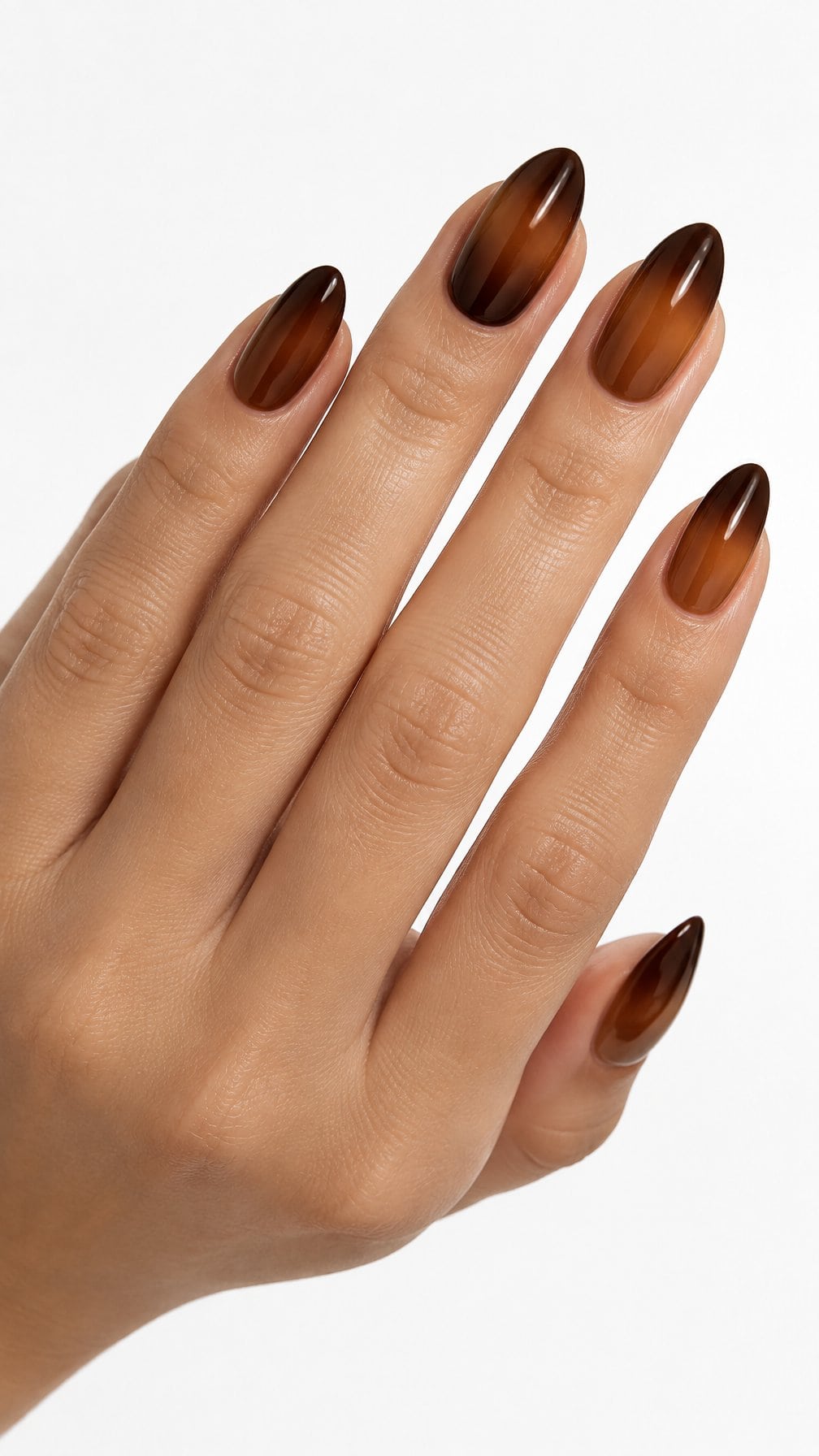 Glossy almond-shaped nails featuring a warm amber-to-chocolate brown gradient