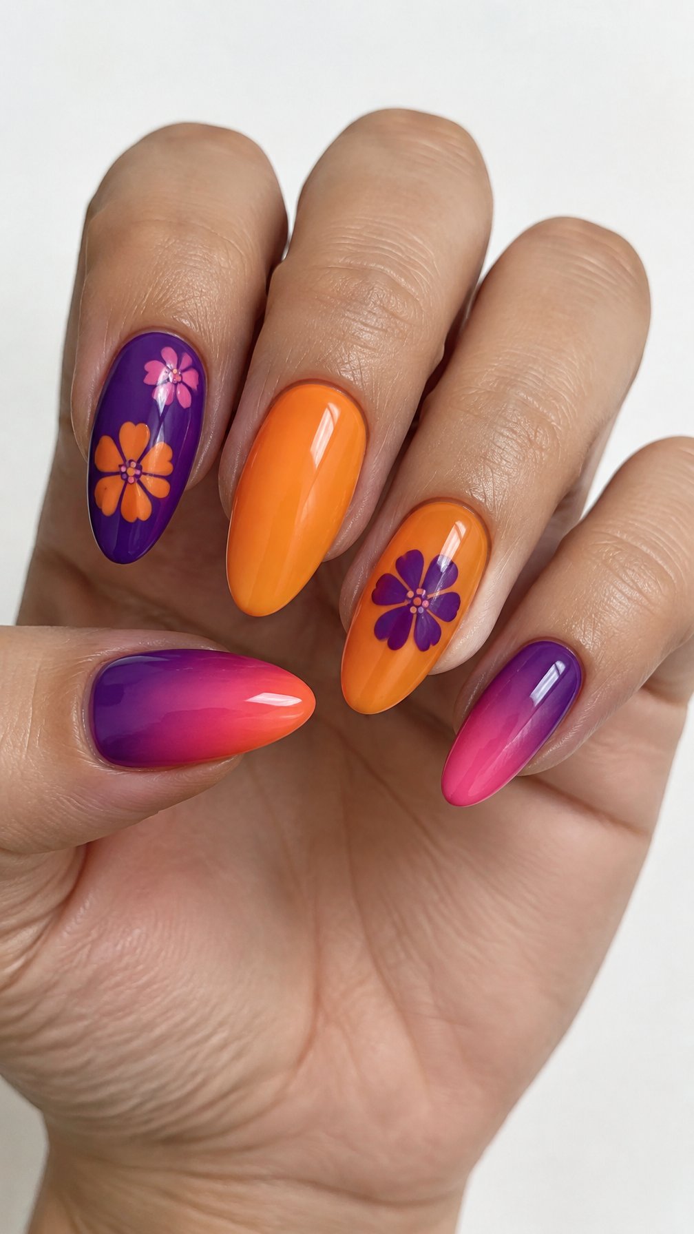 Glossy purple, orange, and pink floral manicure on almond-shaped nails