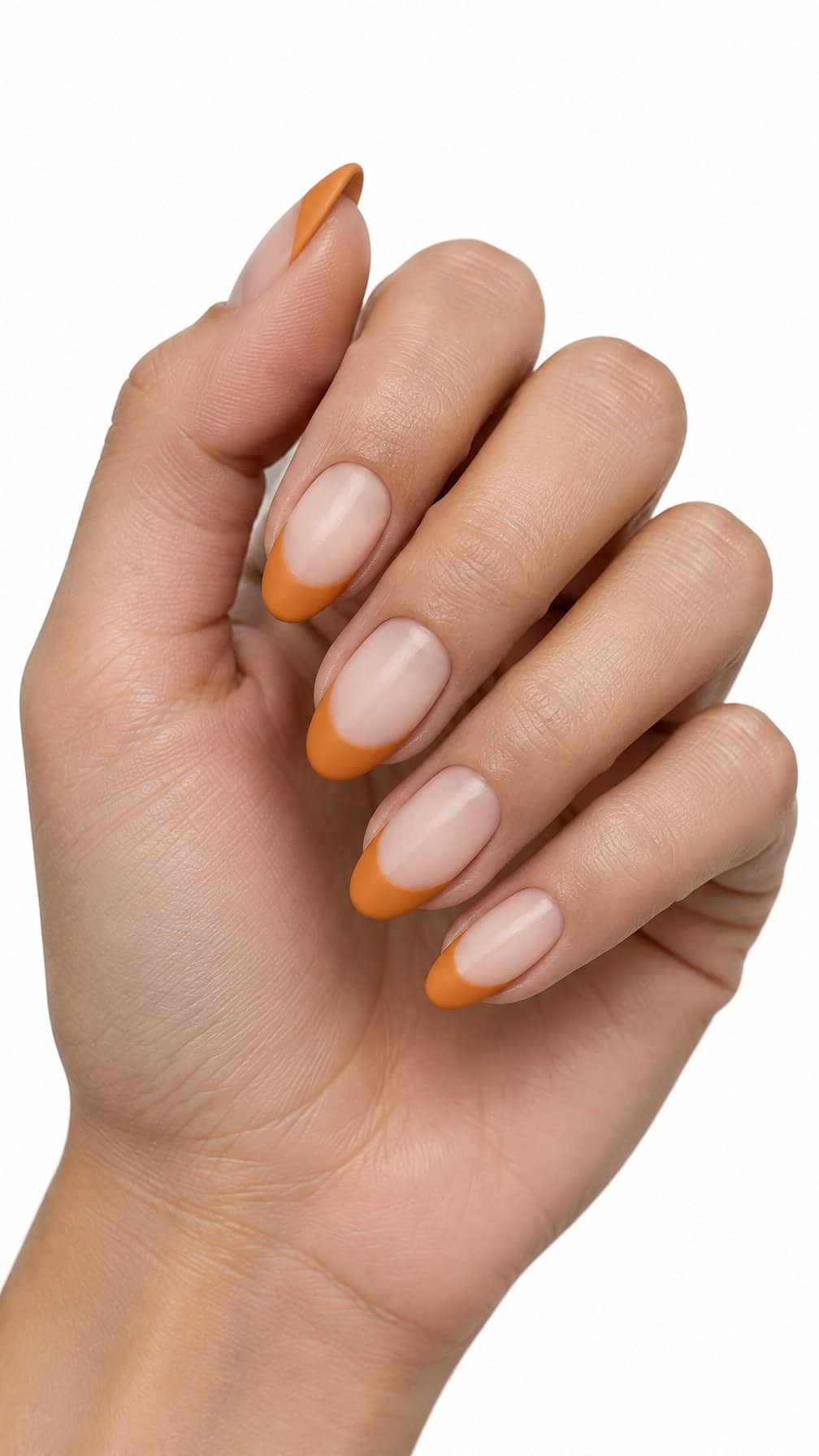 Almond-shaped nails featuring matte pumpkin-orange French tips on a sheer nude base
